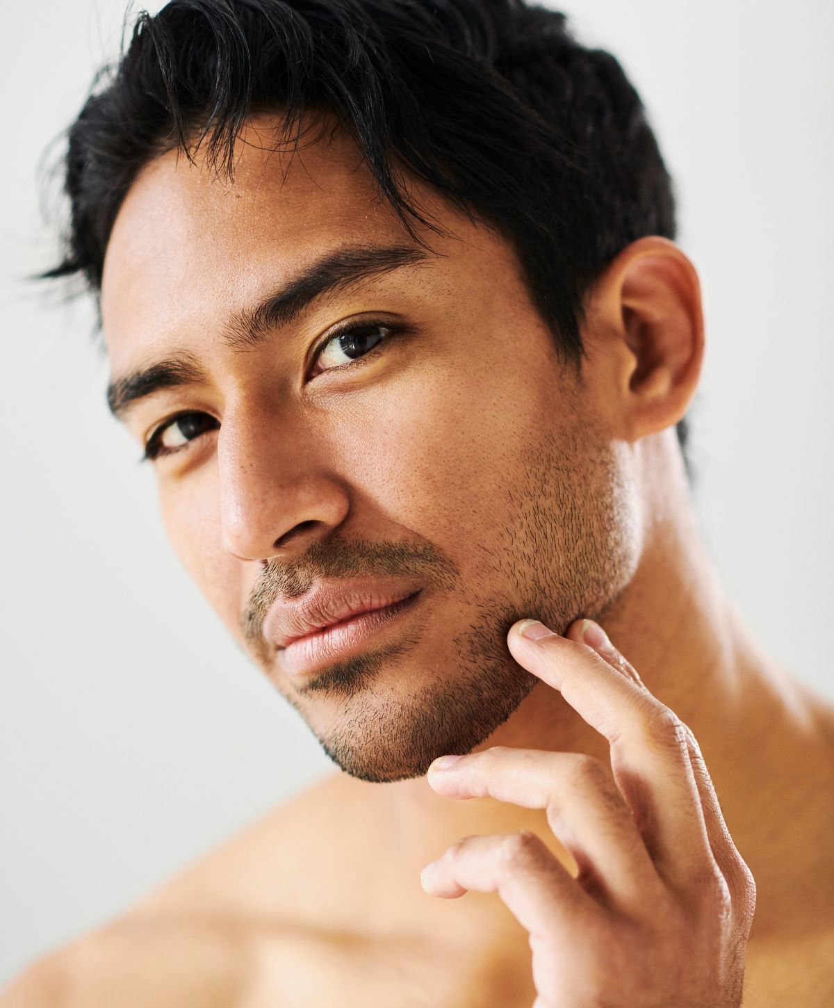 woodland hills hair restoration model touching their face